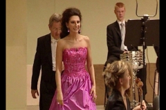 Photo taken from the Video-Lucia Aliberti  with the conductor Peter Falk-Semperoper Dresden-Dresden-Concert-Sony Music-Live DVD Recording-Sinfonieorchester Hochschule fur Musik Dresden Carl Maria Von Weber-On Stage-Escada Fashion:http://www.luciaaliberti.it #luciaaliberti #peterfalk #semperoperdresden #dresden #concert #sinfonieorchesterhochschulefurmusikdresdencarlmariavonweber #sonymusic #livedvdrecording #onstage #portraitseries #escadafashion